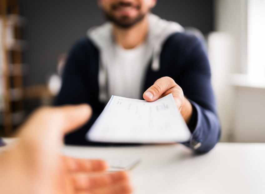 Man getting paycheck unsure of progressive tax rate